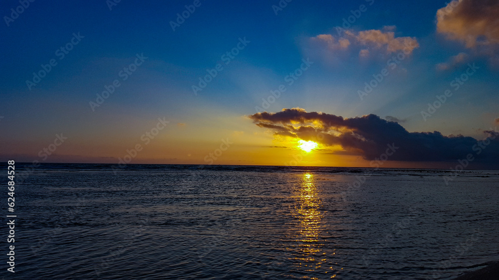 sunset over the sea sunset sunrise over the sea horizon golden sun cloudy sky