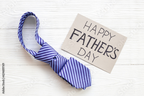 Happy Fathers day postcard with blue tie, top view