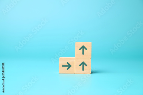 Arrow up icon on wooden blocks, Business growth success process, Business achievement goal and target, Planning and development for corporation