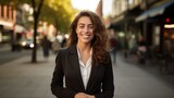 Young confident smiling business woman standing on busy street, portrait. Proud successful female entrepreneur wearing suit posing with arms crossed look at camera in big city outdoors. Generative  Ai
