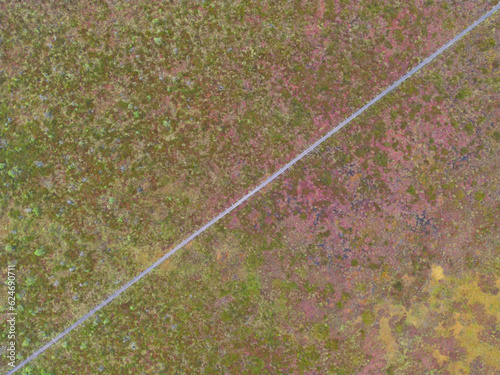 Wooden road in the Marimetsa swamp, aerial view in summer. photo