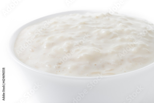Rice pudding. Arroz con leche. Rice pudding in white bowl isolated on white background. Close up