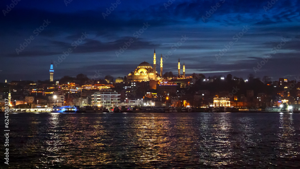 Istanbul, Turkey - February 2023: Hagia Sofia Mosque reflecting in the Bosphorus sea water at night.