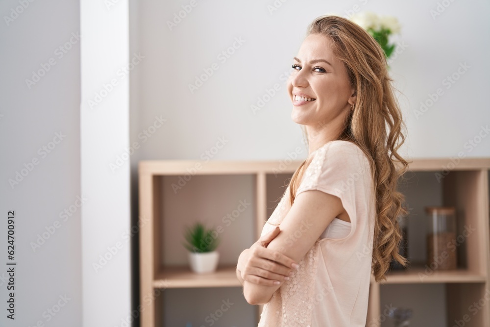 Young blonde woman smiling confident standing with arms crossed gesture at home Young blonde woman smiling confident standing with arms crossed gesture at home