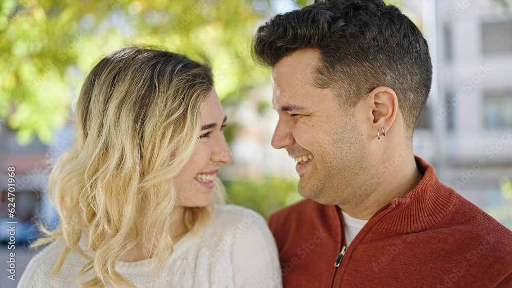 Man and woman couple smiling confident standing together at park Man and woman couple smiling confident standing together at park