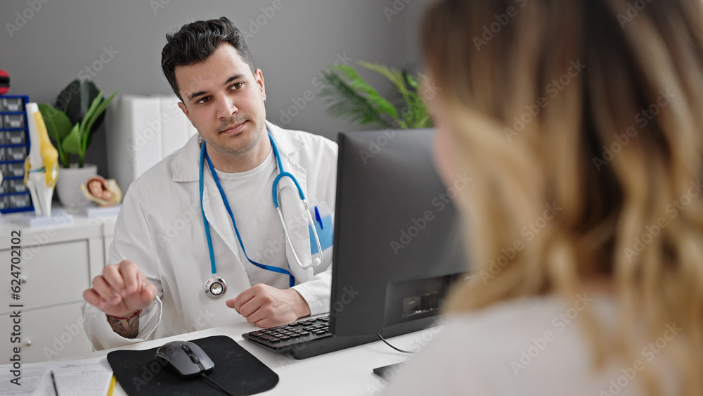 Man and woman doctor and patient having consultation at clinic Man and woman doctor and patient having consultation at clinic