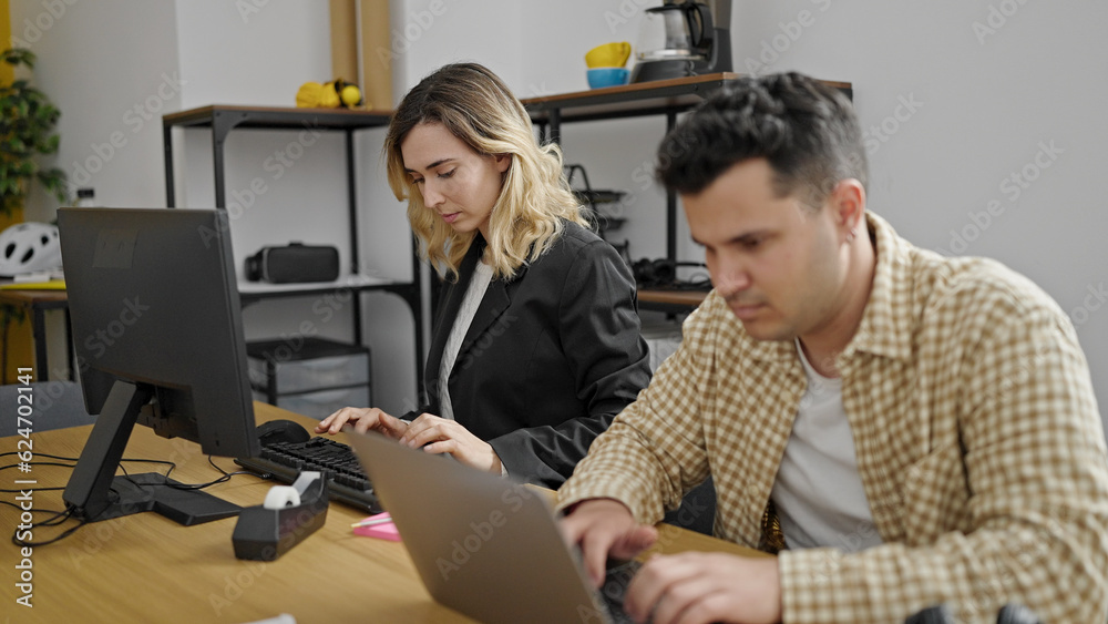 Man and woman business workers working together at office Man and woman business workers working together at office