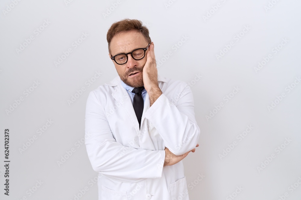 Middle age doctor man with beard wearing white coat thinking looking tired and bored with depression problems with crossed arms. Middle age doctor man with beard wearing white coat thinking looking tired and bored with depression problems with crossed arms.