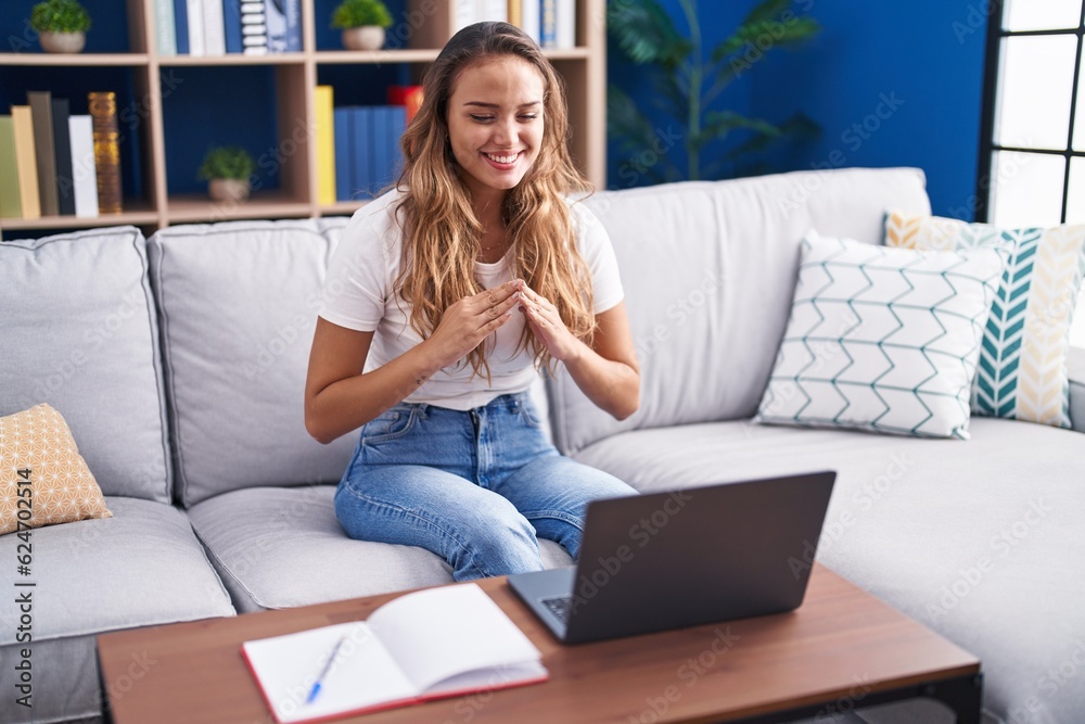 Young beautiful hispanic woman having video call communicate with sign deaf language at home Young beautiful hispanic woman having video call communicate with sign deaf language at home