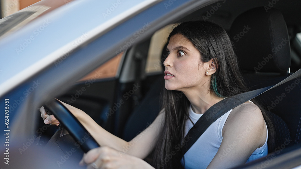 Young beautiful hispanic woman stressed driving car at street Young beautiful hispanic woman stressed driving car at street