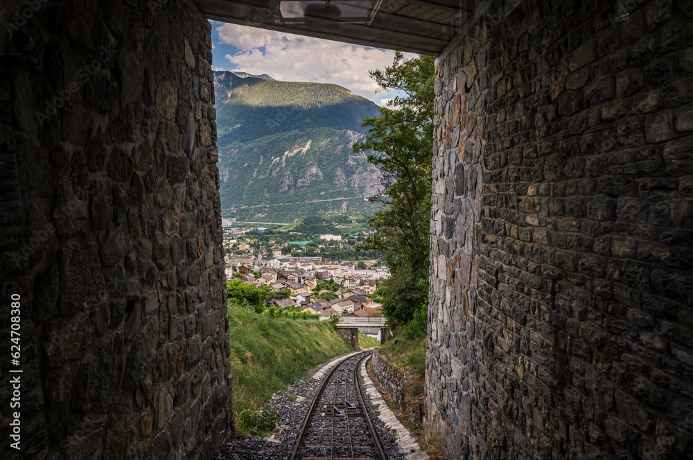 Tunnels and railways. Light on the end of the tunnel. Crans Montana, Valais Canton, Switzerland.