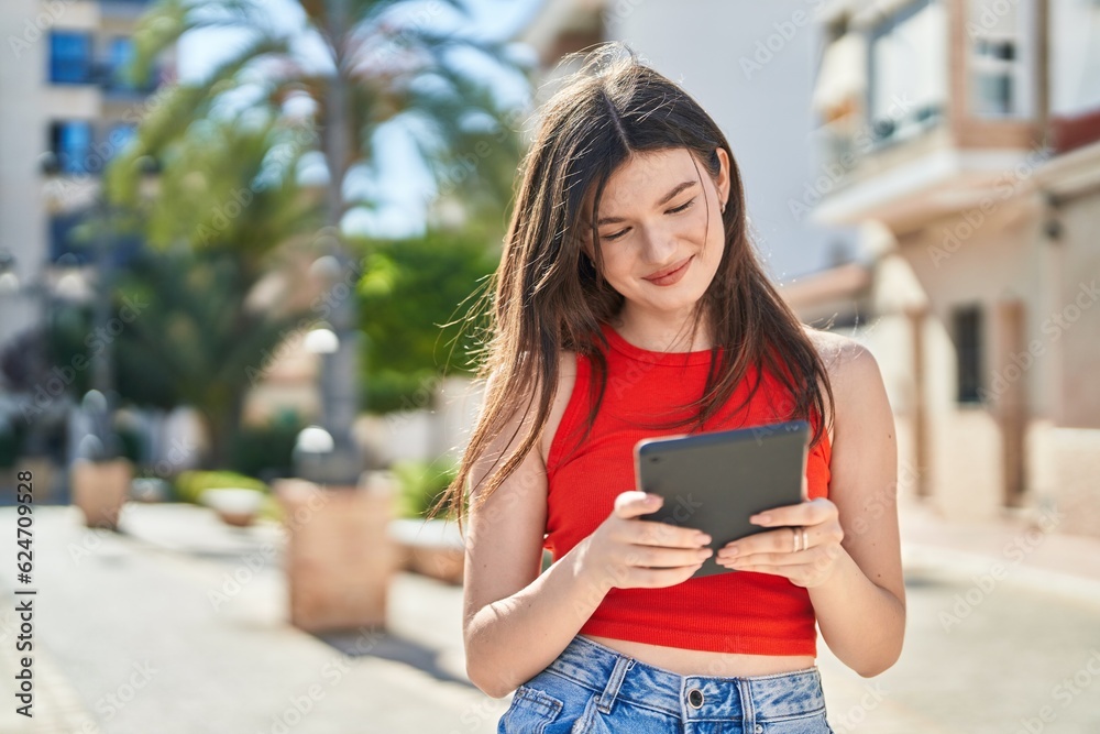 Young caucasian woman smiling confident using touchpad at park Young caucasian woman smiling confident using touchpad at park