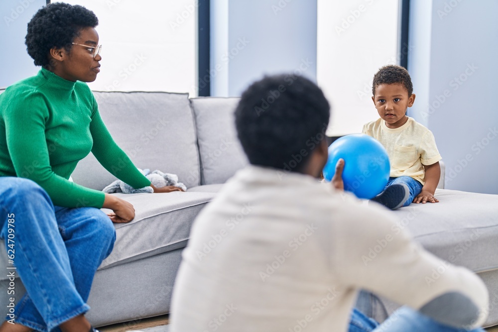 African american family playing with ball at home African american family playing with ball at home