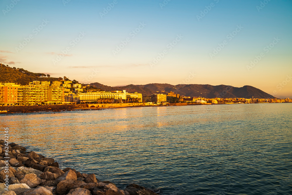 Evening sun hits the shoreline of the coast of Lungomare Clemente Tafuri, Salerno