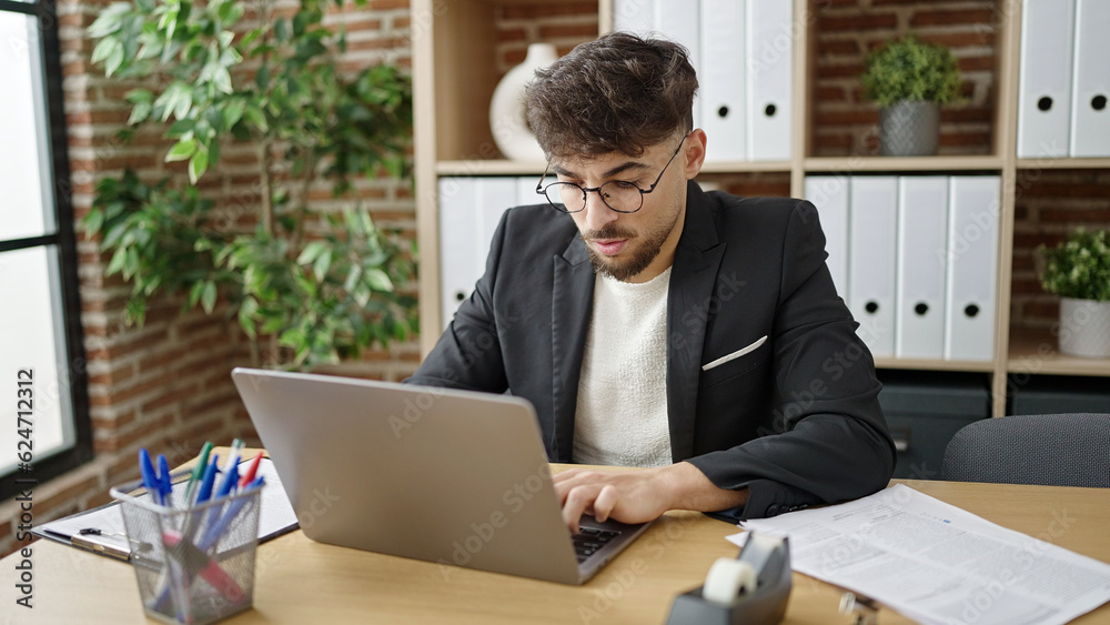 Young arab man business worker using laptop working at office