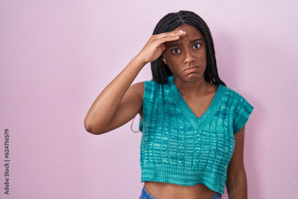 Young african american with braids standing over pink background worried and stressed about a problem with hand on forehead, nervous and anxious for crisis Young african american with braids standing over pink background worried and stressed about a problem with hand on forehead, nervous and anxious for crisis