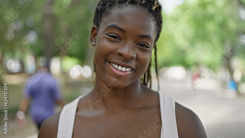 African american woman smiling confident standing at park