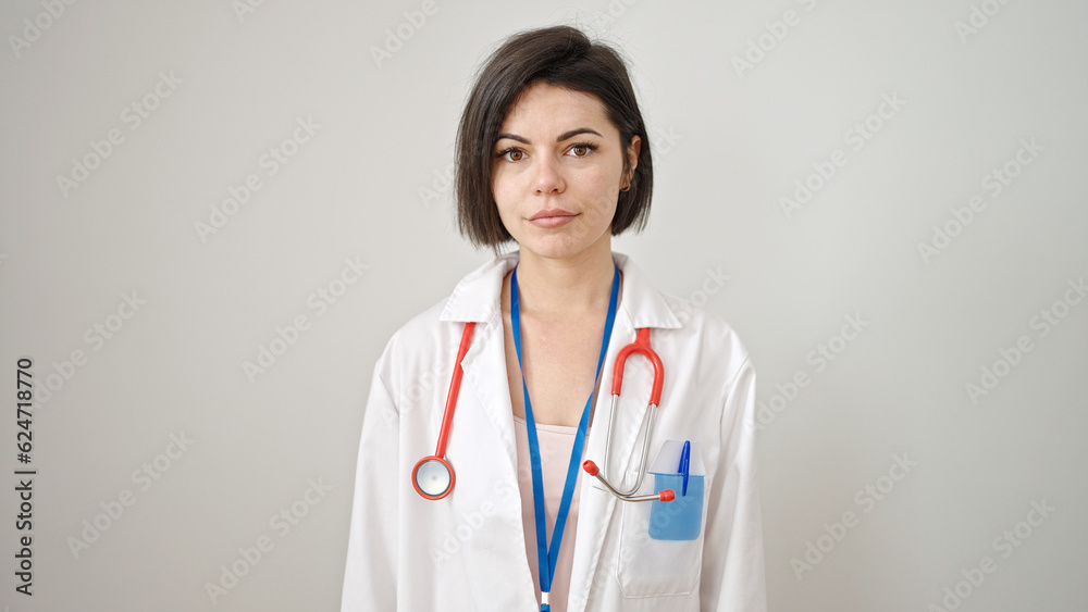 Fototapeta premium Young caucasian woman doctor standing with serious expression over isolated white background