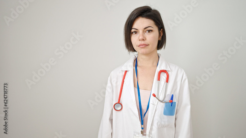 Young caucasian woman doctor standing with serious expression over isolated white background