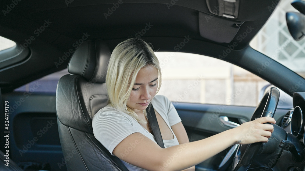 Young beautiful hispanic woman smiling confident wearing car belt at street