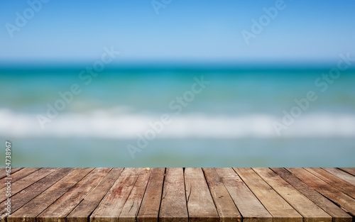 Wooden board empty table in front of blurred sea background