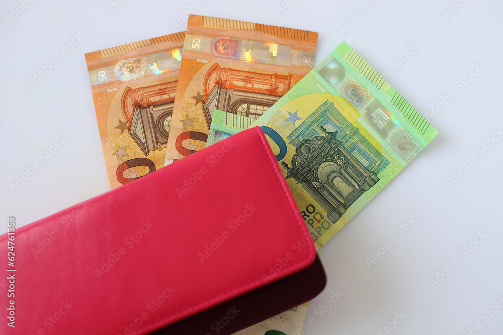 Euro currency money and red wallet on white background Euro currency money and red wallet on white background