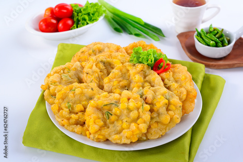 bakwan jagung Corn fritters are a snack made from corn and flour photo