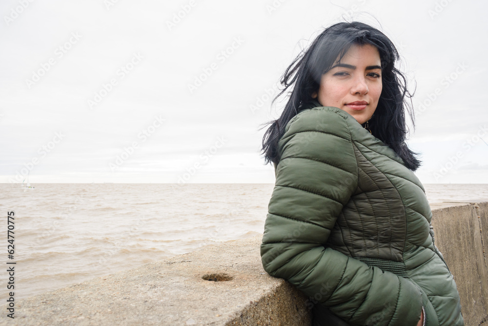 portrait of young latin woman tourist at the pier of the port of olivos in Buenos Aires portrait of young latin woman tourist at the pier of the port of olivos in Buenos Aires