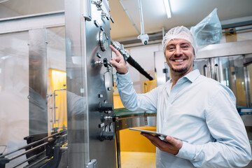 happy fatory engineer technician machine operate config setting working in food and drink factory