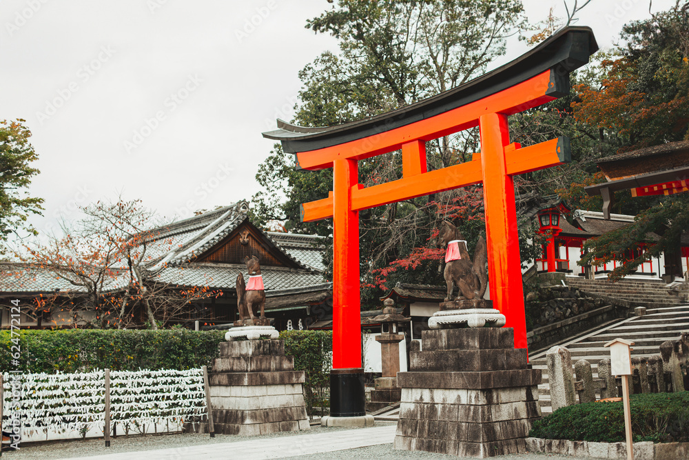 Torii red wooden gate Japan traditional in Shinto shrines temple entrance symbol of transition from the mundane to the sacred Torii red wooden gate Japan traditional in Shinto shrines temple entrance symbol of transition from the mundane to the sacred