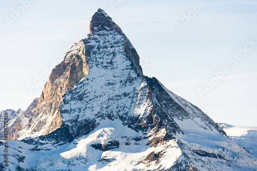 Snowy mountain Matterhorn during the day in winter. Zermatt, swiss alps