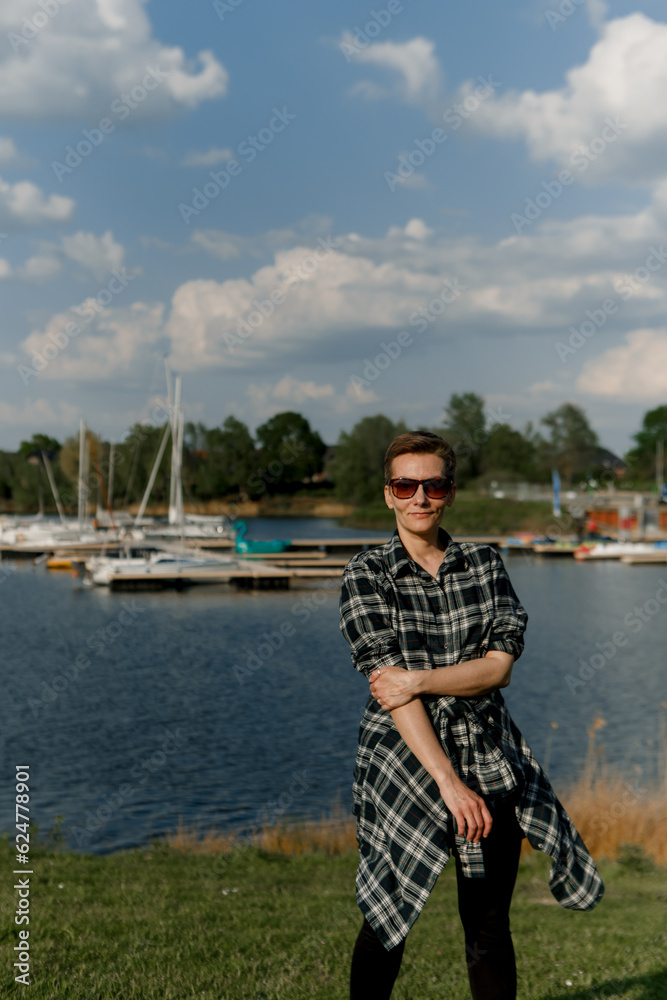 woman tourist travel shore background lake yachts