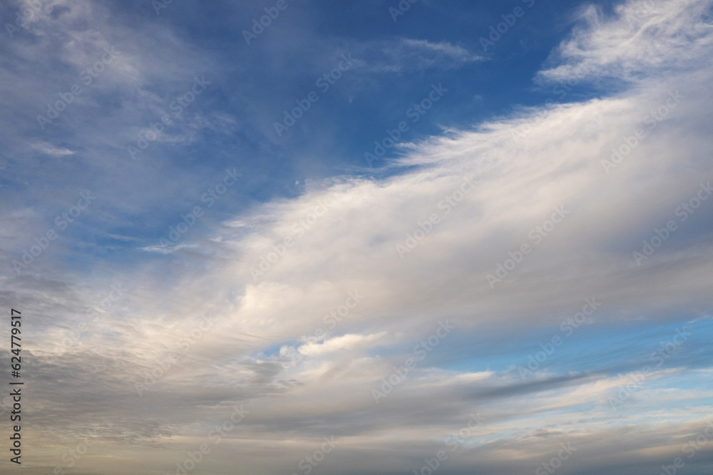 Blue sky with different shape clouds. Nature background for design. Paradise concept.