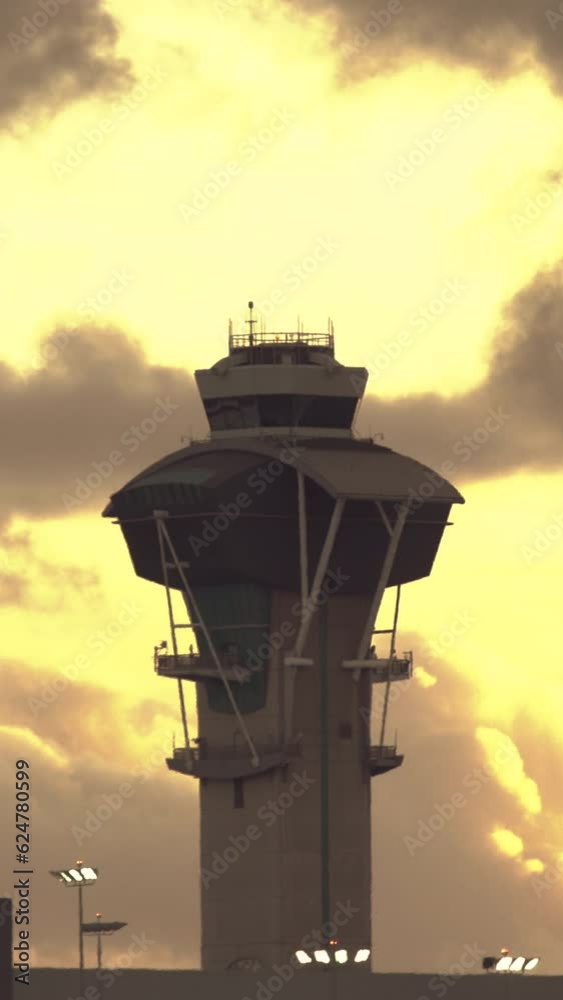 Large passenger airplane taking off against beautiful sunset. Jet plane taking off and climbing into the sunset. Aerial vertical background, vertical video background, vertical video. Large passenger airplane taking off against beautiful sunset. Jet plane taking off and climbing into the sunset. Aerial vertical background, vertical video background, vertical video.