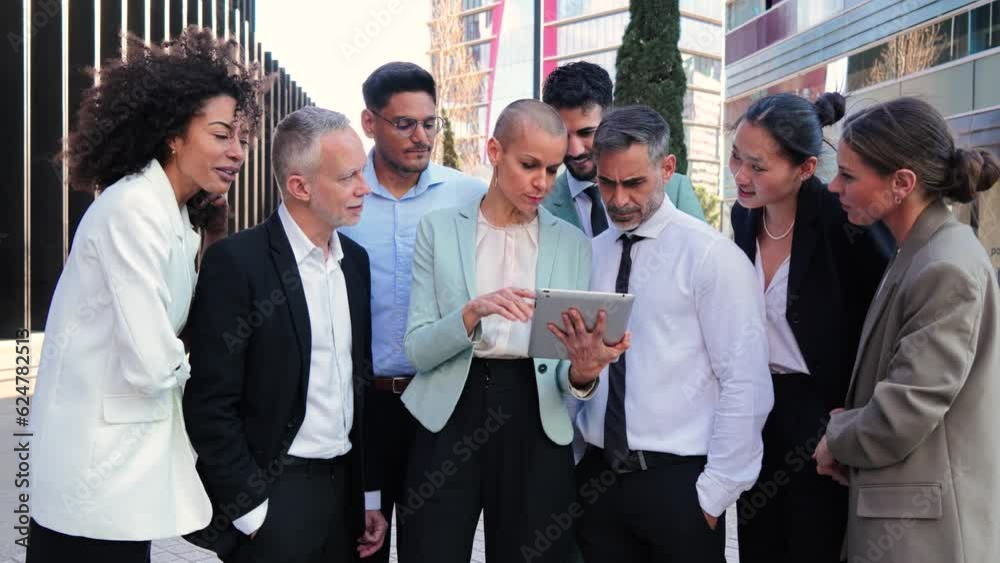 Group of business people teamwork or coworkers talking on a briefing coperating together. Businesswoman in formalwear using a digital tablet to show improvements to her partners, standing at workplace