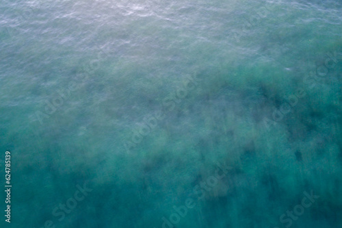 Sea surface aerial view  bird eye view photo of green waves and water surface texture Turquoise sea background  Amazing view sea background