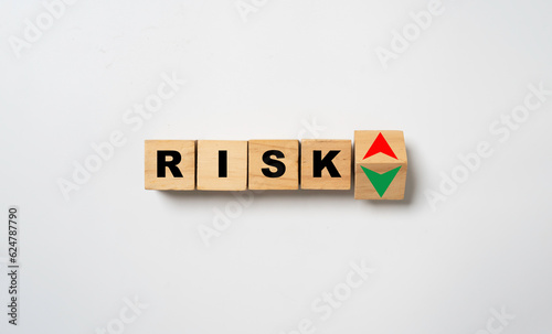 Risk wording with up and down arrow for Risk management and assessment concept.