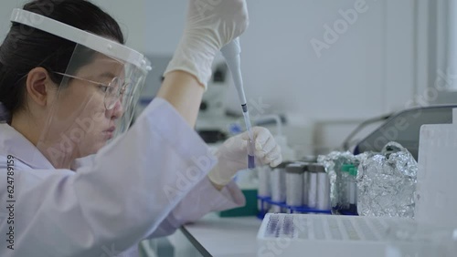 Scientist working in the lab, Development and research of chemical developers, Testing various chemical.