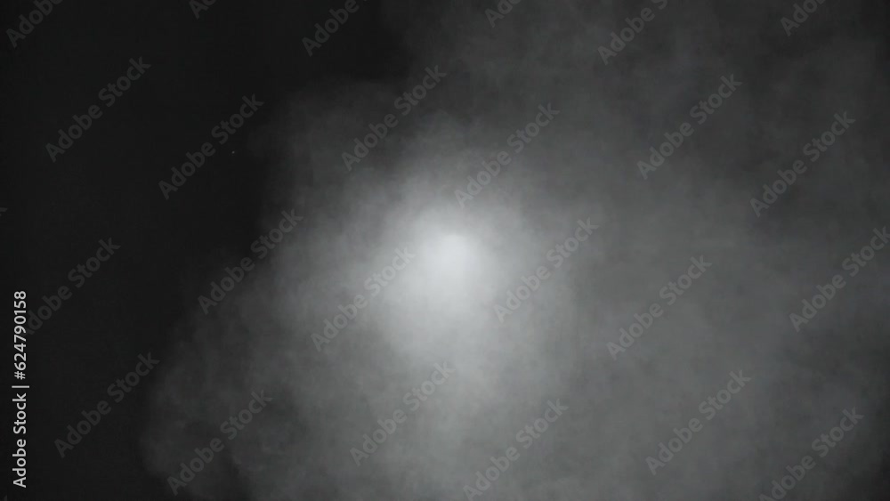 Close up scene of smoke spout out of hole, hot vapor rise up on boil water, exhaust pipe toxic fume, white spray color isolated on black background, steam of perfume fog in front view
