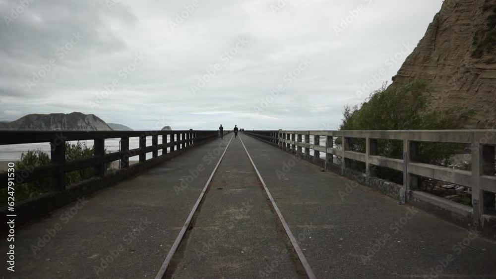 Walking at Tolaga Bay bridge in New Zealand. Walking at Tolaga Bay bridge in New Zealand.