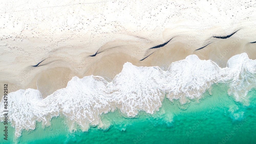 An aerial shot of the aftermath of a crashing wave An aerial shot of the aftermath of a crashing wave