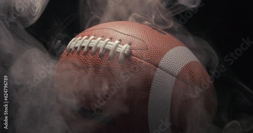Football ball in studio with smoke anamorphic 4K