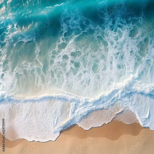 Overhead photo of crashing waves on the shoreline beach. Tropical beach surf. Abstract aerial ocean view