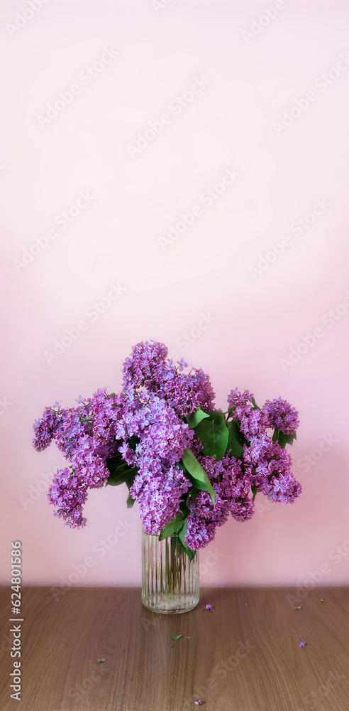Bouquet of lilac on the desktop, on a white background Bouquet of lilac on the desktop, on a white background