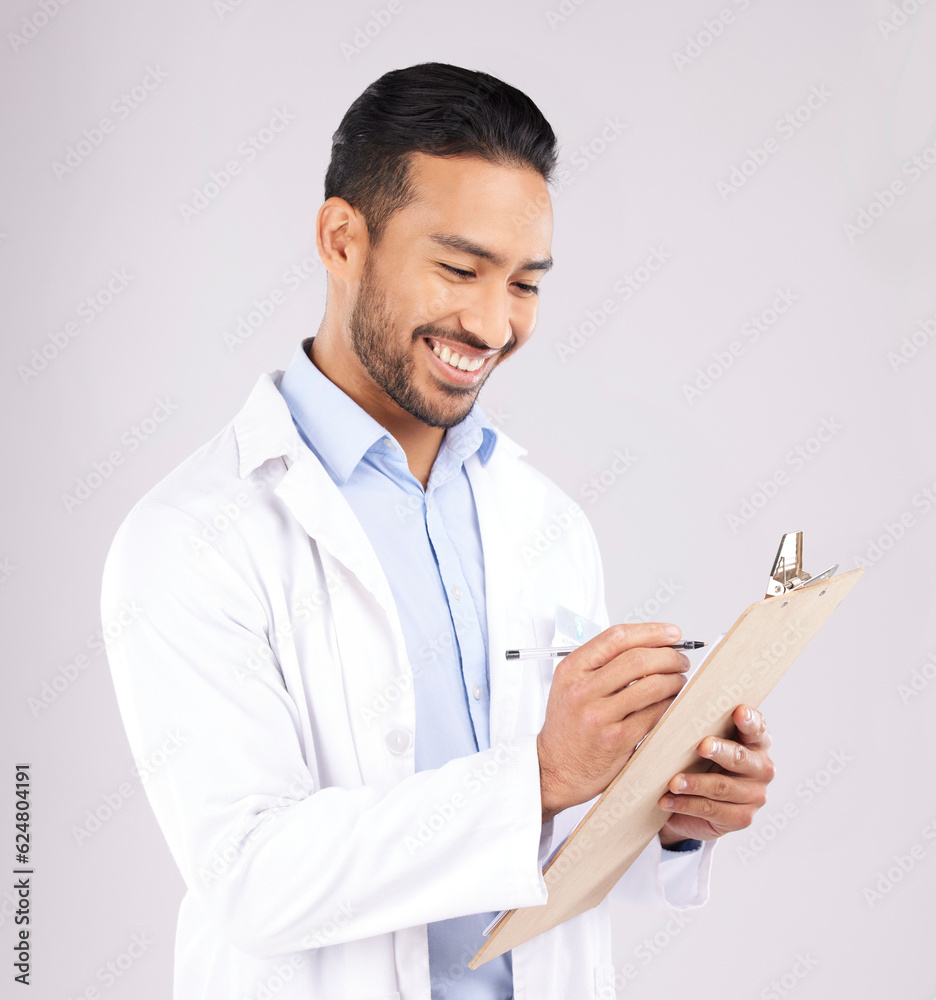 Writing, smile and happy man doctor with checklist in studio for medical, compliance or insurance on grey background. Healthcare, form and male health expert check paperwork or agenda schedule notes Writing, smile and happy man doctor with checklist in studio for medical, compliance or insurance on grey background. Healthcare, form and male health expert check paperwork or agenda schedule notes