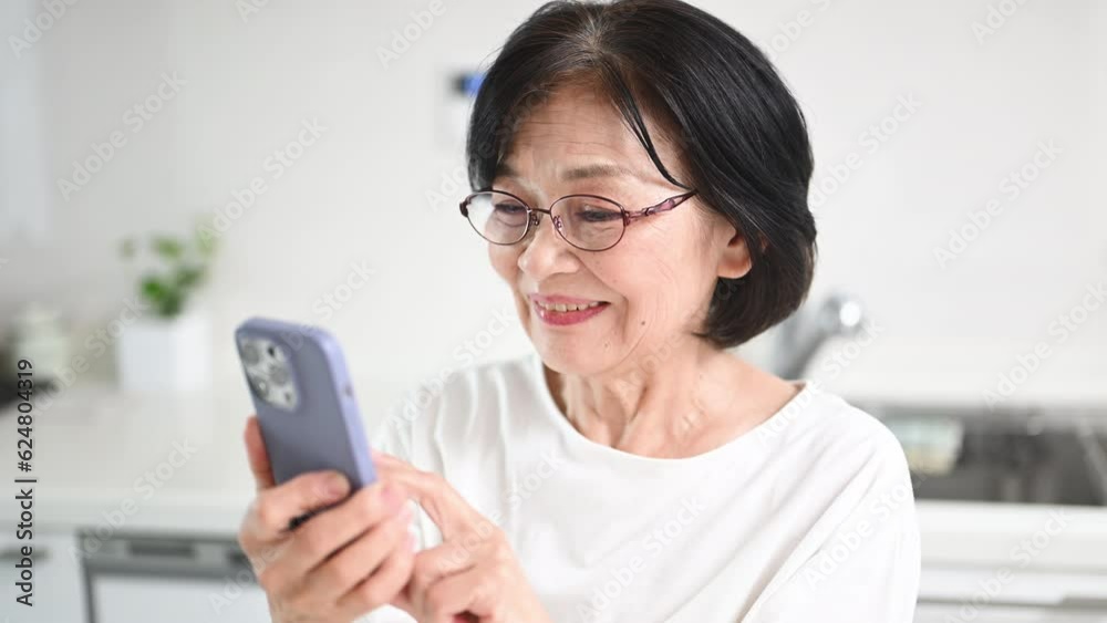 Video of elderly Japanese tapping on a cell phone Video of elderly Japanese tapping on a cell phone