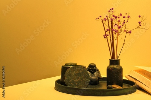 Aroma candle and dry flowers in ceramic vase on table. Zen  relax  wellness concept. Decoration organic equipment in spa salon. Natural composition for meditation. Healthy beauty lifestyle.