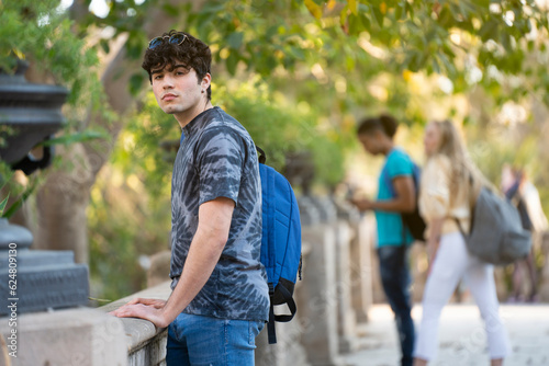 Serious student looking to the camera in university campus