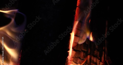 Burning smoldering wood and coals in fireplace. Cooking in natural grill concept photo