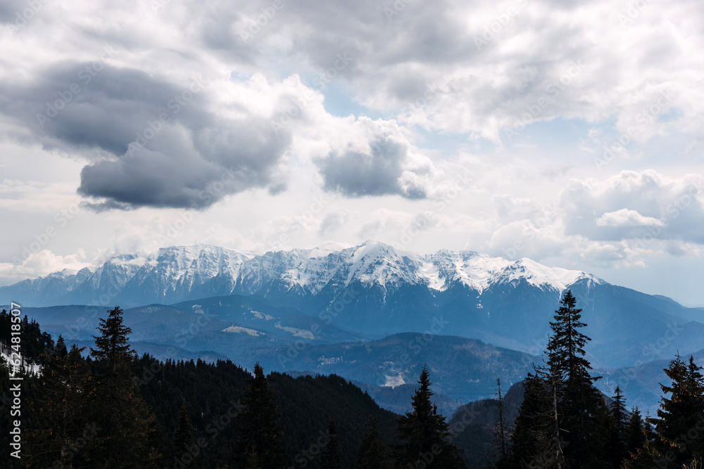 view over snowy Bucegi mountains on cold winter day.